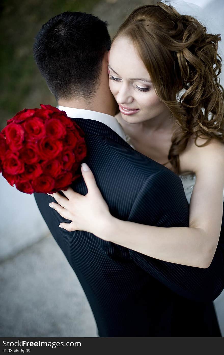 Close up portrait of a happy just married couple embracing each-other. Close up portrait of a happy just married couple embracing each-other