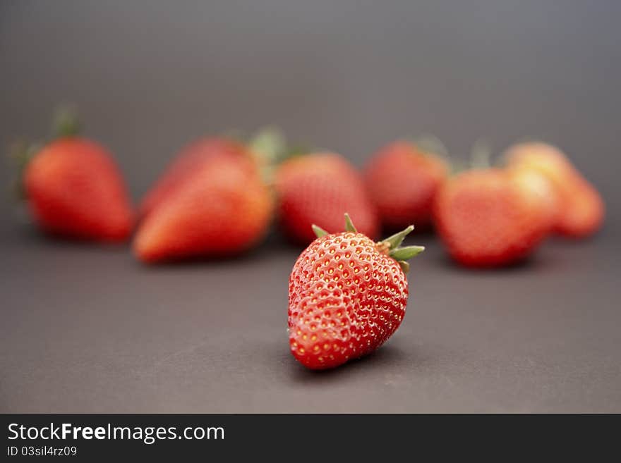 Group of fresh red strawberry isolated on black background