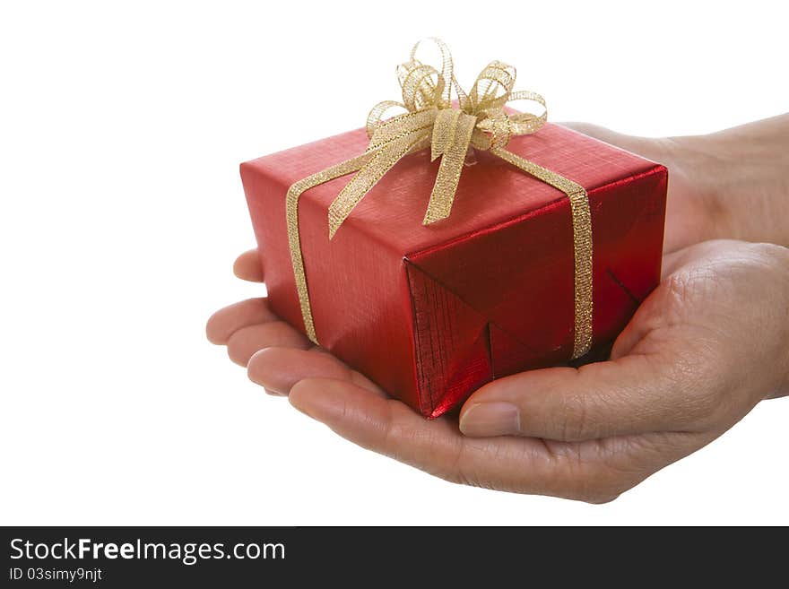 Red Gift Box On Hands Over The White Background