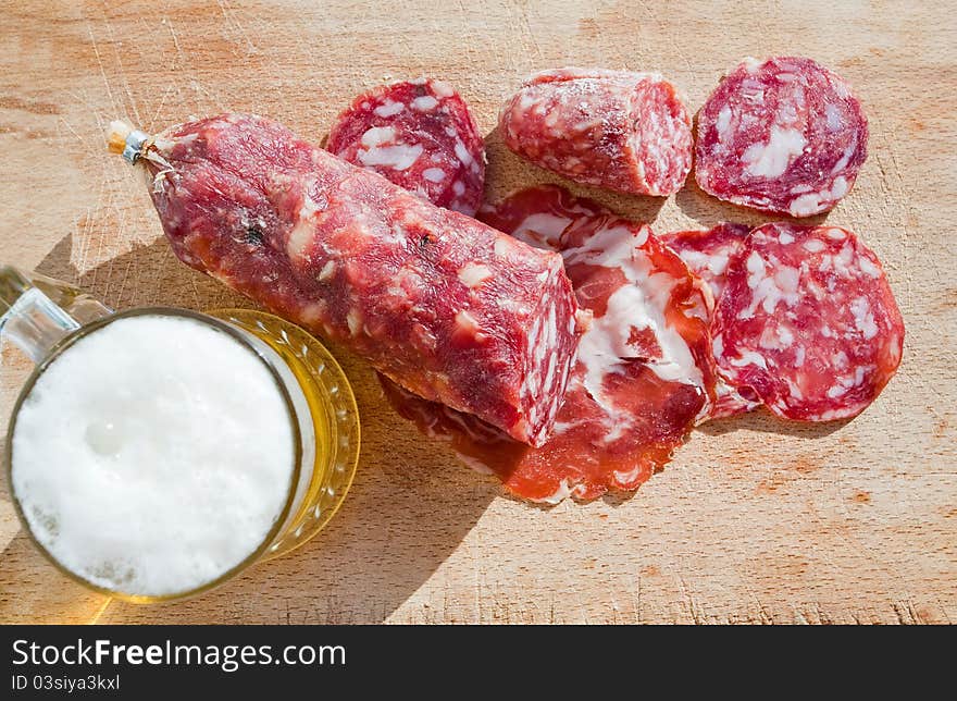 Italian salami and glass of beer outdoor