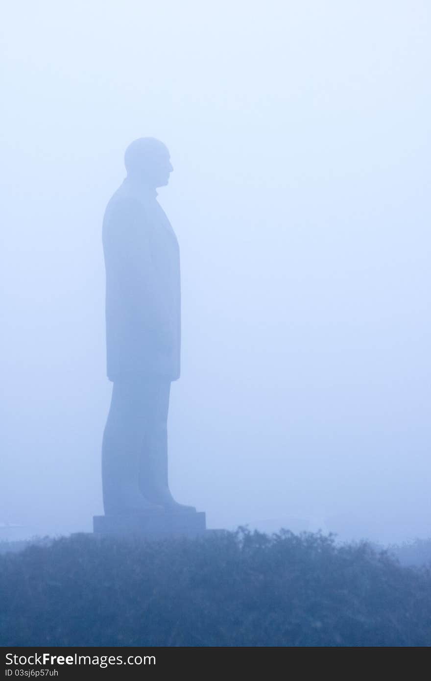 A statue viewed on a foggy day. A statue viewed on a foggy day