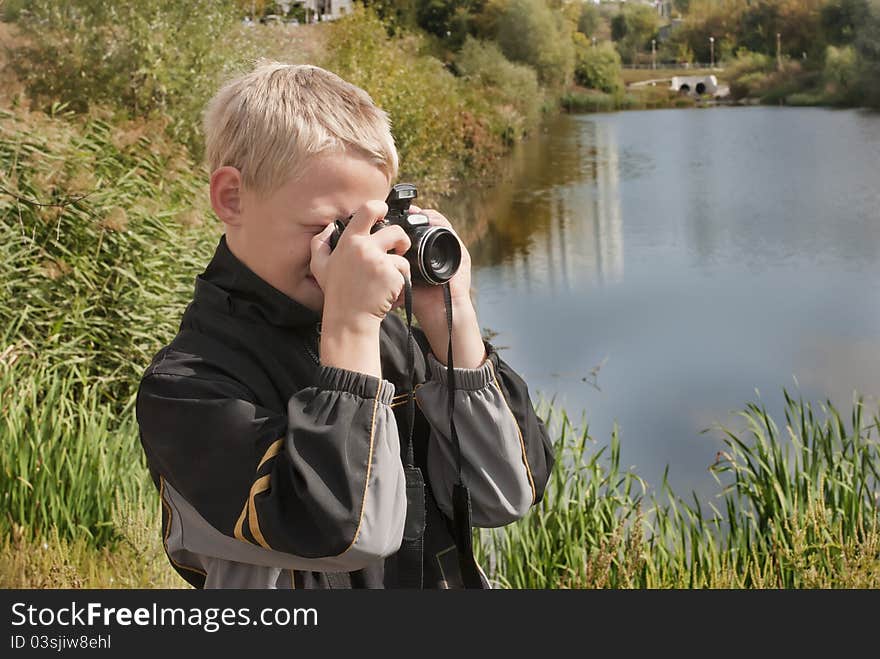 The boy costs about lake and has control over the chamber. The boy costs about lake and has control over the chamber