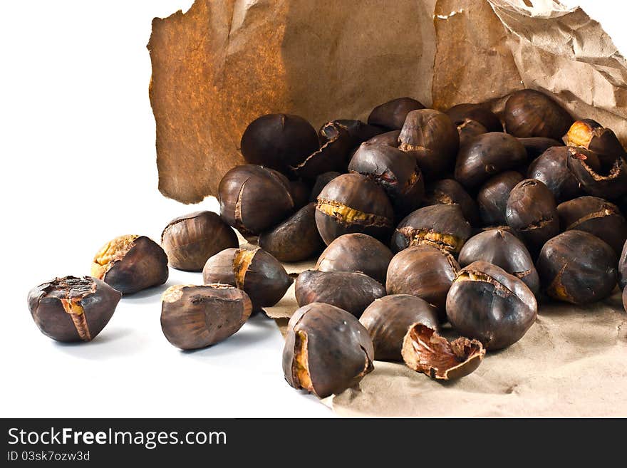 Handful of chestnuts roasted on a lot. Handful of chestnuts roasted on a lot