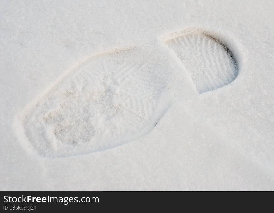 Trace of the man s shoe in the snow