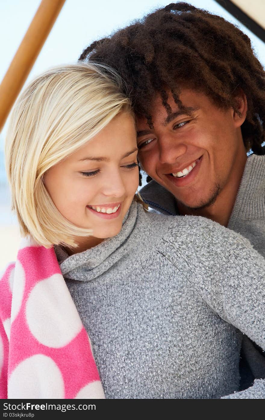 Portrait teenage couple outdoors having fun