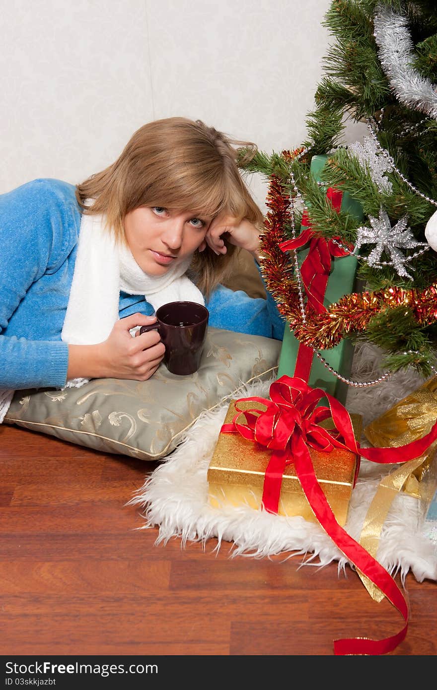 Young woman near a fir-tree