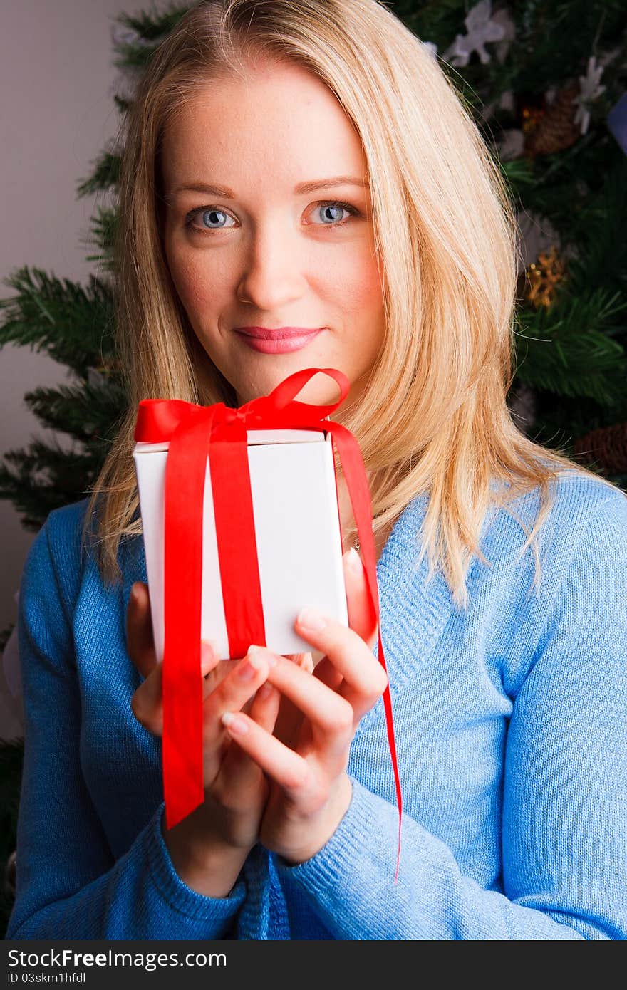 Beautiful  woman  with a Christmas gift