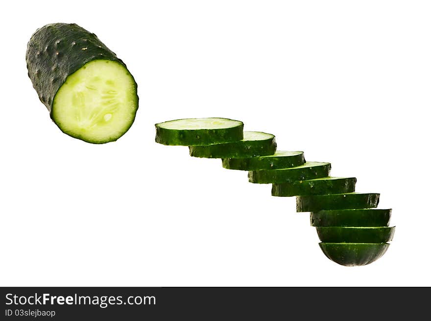 Cucumber half cut and slices isolated over white background. Cucumber half cut and slices isolated over white background.