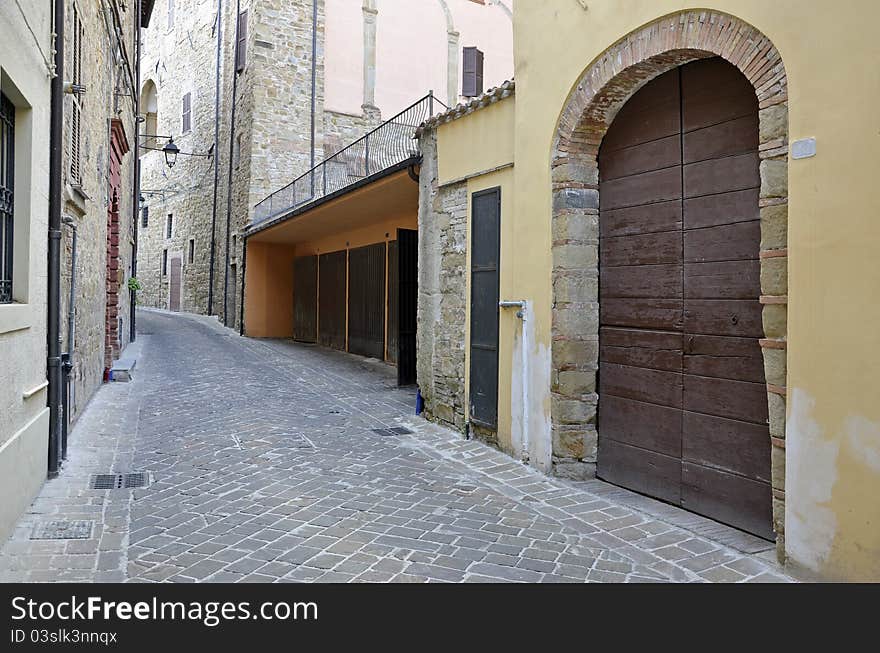 Garage on medieval street in Italian city of Camerino at 200 km north to Rome