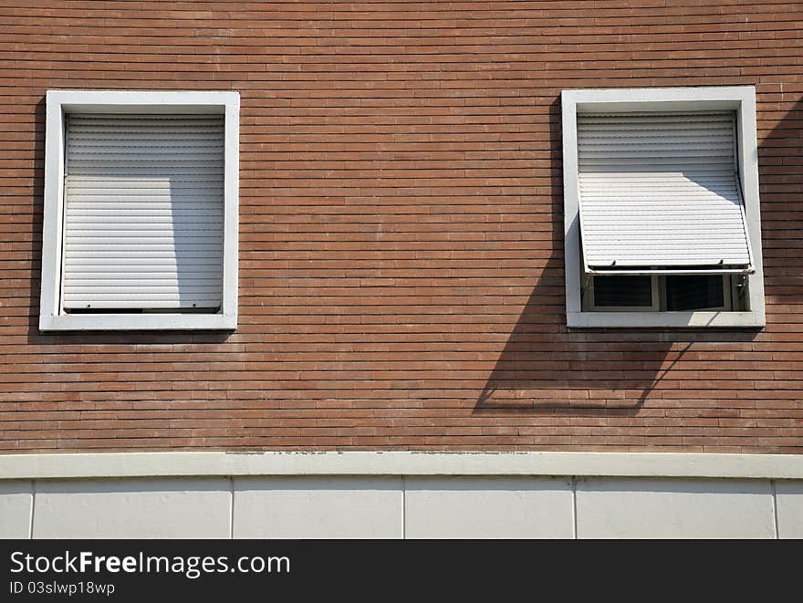 Open and closed window on red wall. Open and closed window on red wall