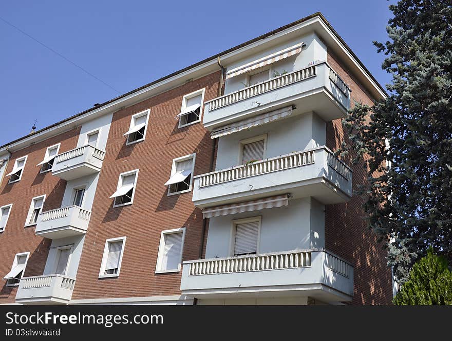 White balcony on red modern building flats