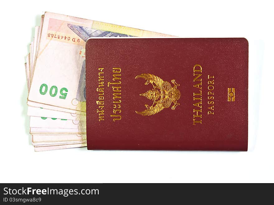 Thailand passport and Thai money on white background