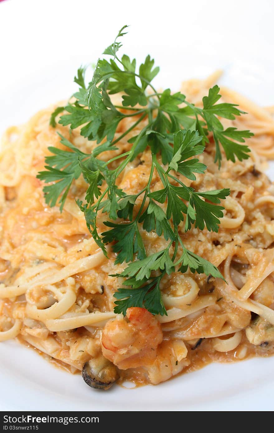 Gourmet seafood pasta served with parsley