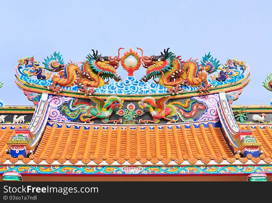 Chinesse dragon statue on blue background. Chinesse dragon statue on blue background