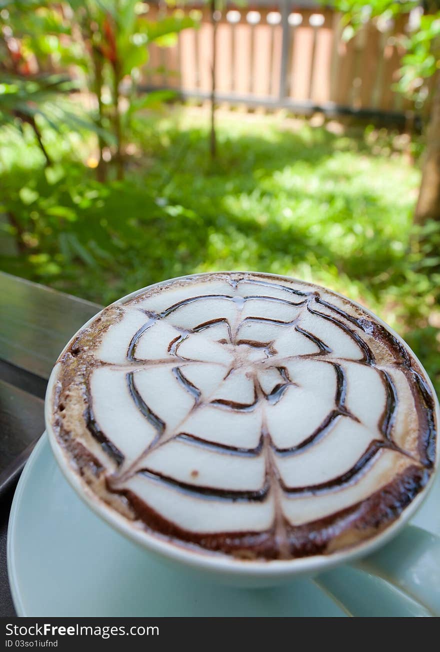 Drinking Coffee In The Garden.