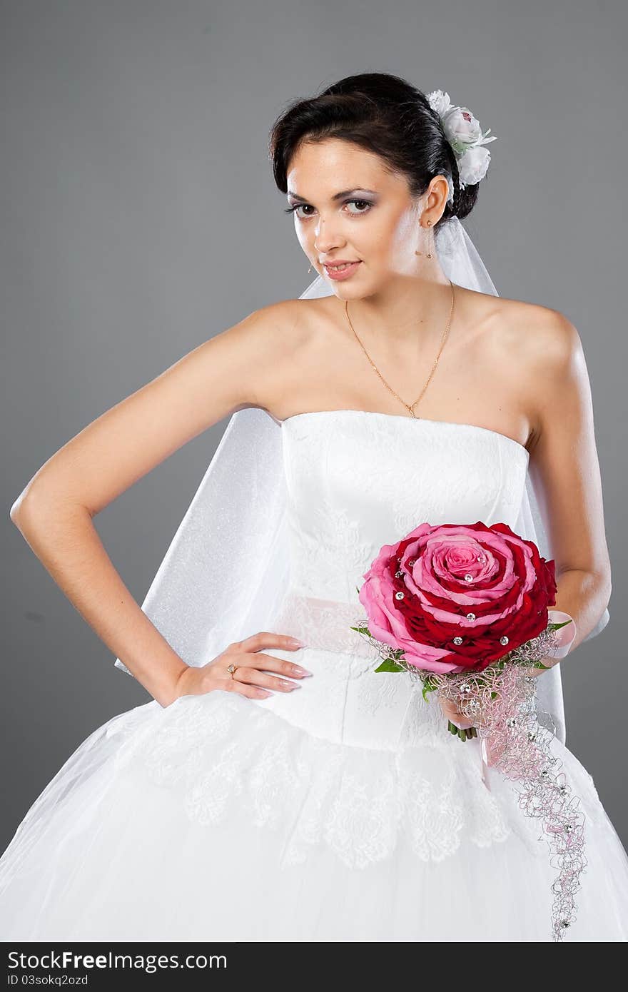 Beautiful brunette bride with a bouquet