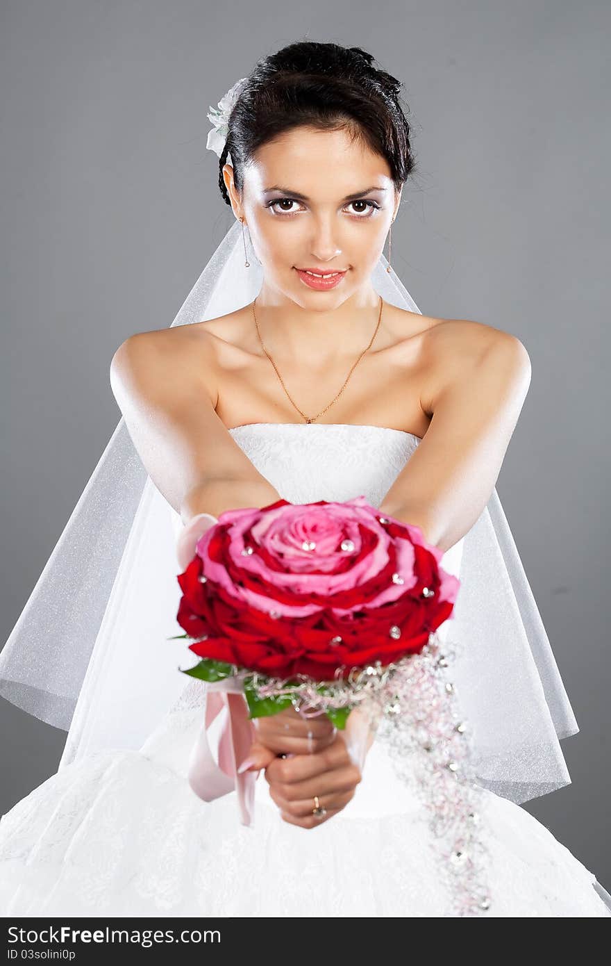 Beautiful brunette bride with a bouquet