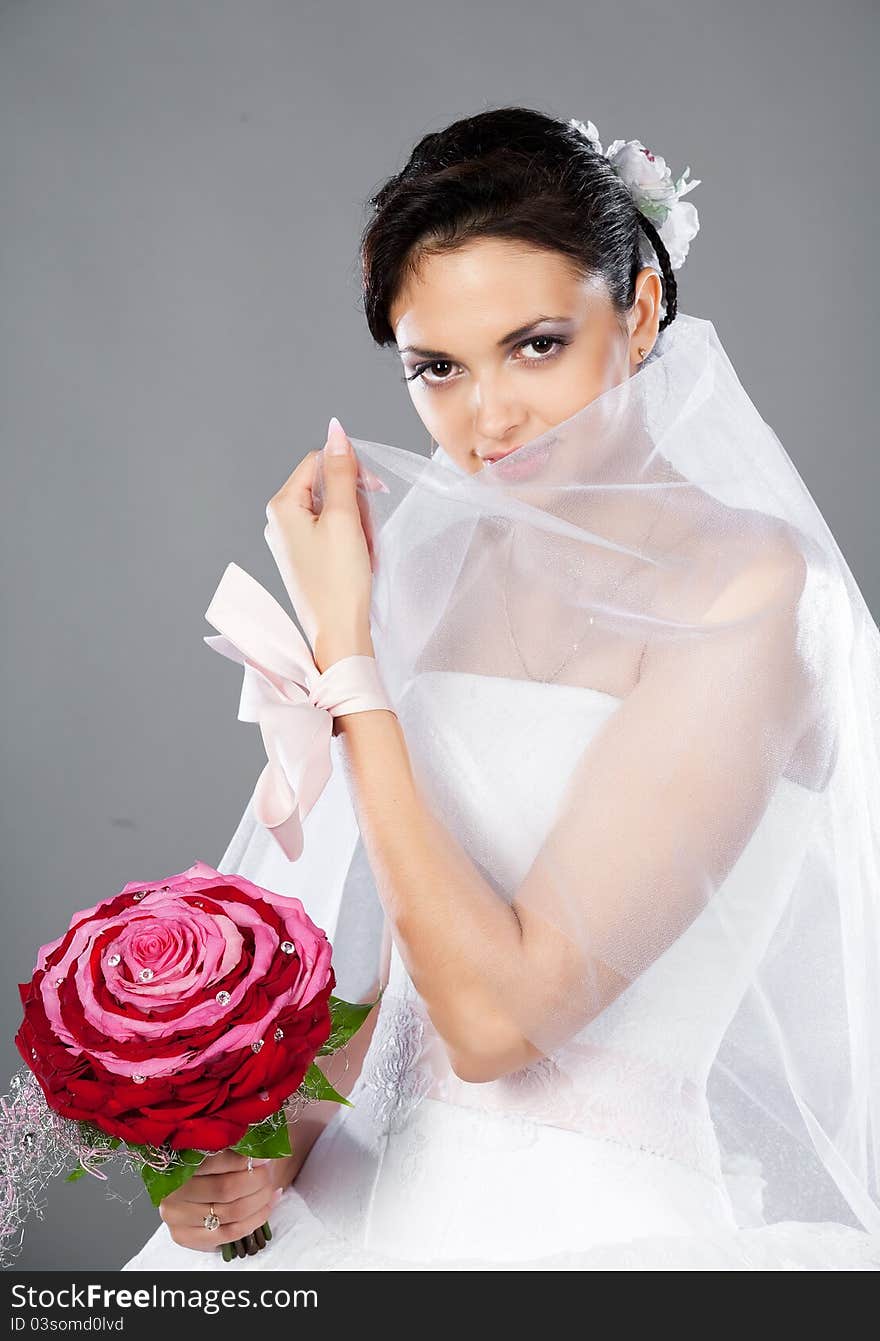 Beautiful brunette bride with a bouquet