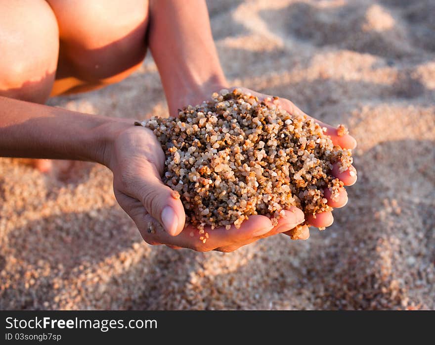 Beach; sand in human hands