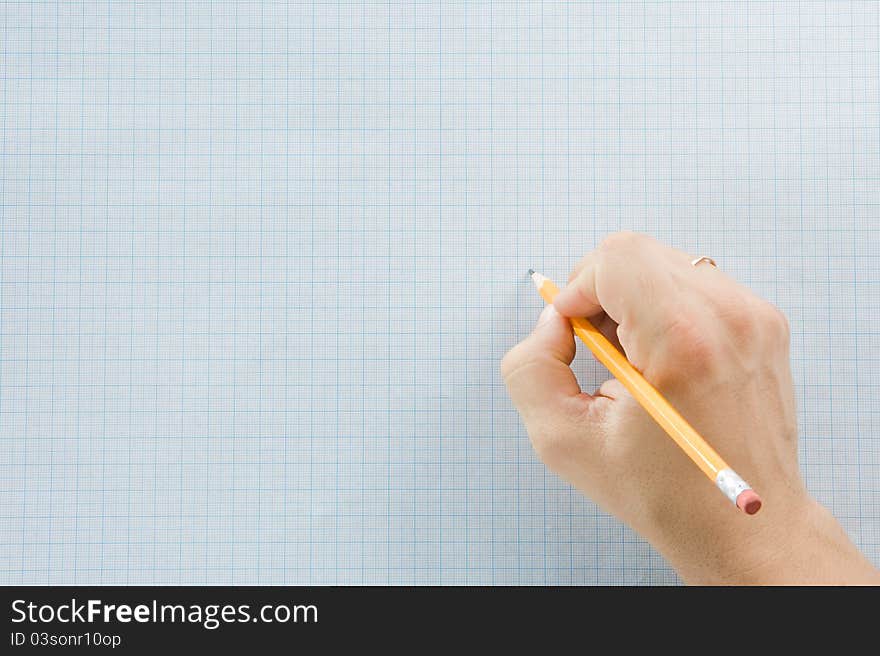 Hand writing by pencil on blue graph grid paper