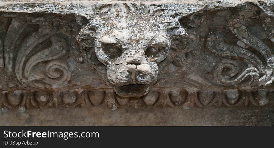 Ancient lion's head carved in stone, in Ephesus - Turkey.