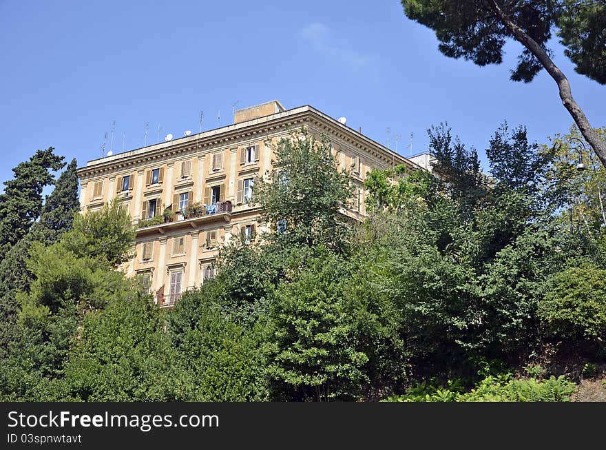 Green place in front of modern building in the center of Rome