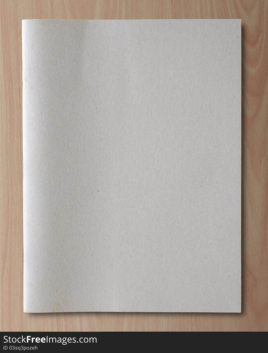 Gray recycled notebook on wood background