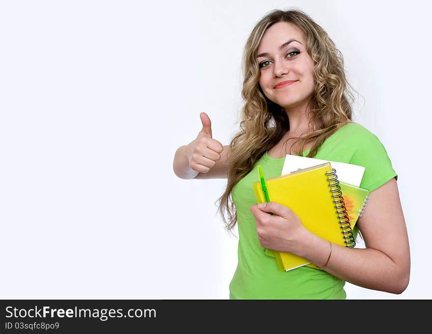 Woman in the green jersey with a notebook. Woman in the green jersey with a notebook