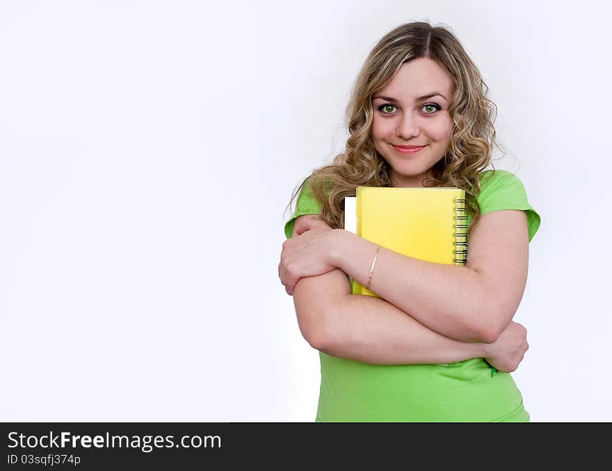 Woman in the green jersey with a notebook. Woman in the green jersey with a notebook