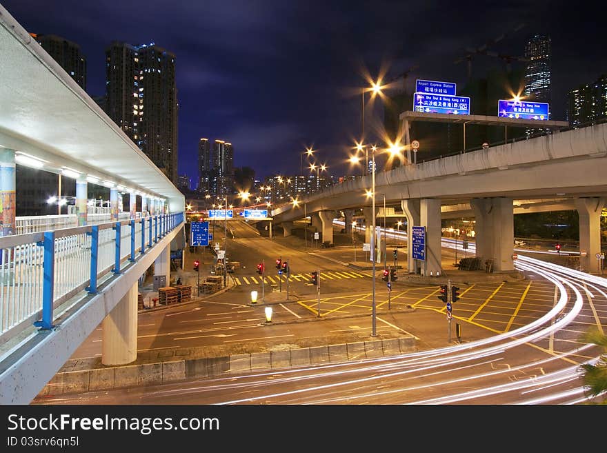 Light trails at night with busy traffic