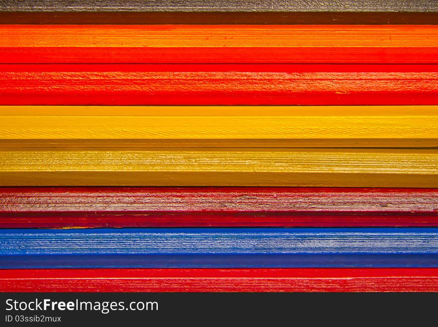 Wooden pencils form colorful background. Wooden pencils form colorful background