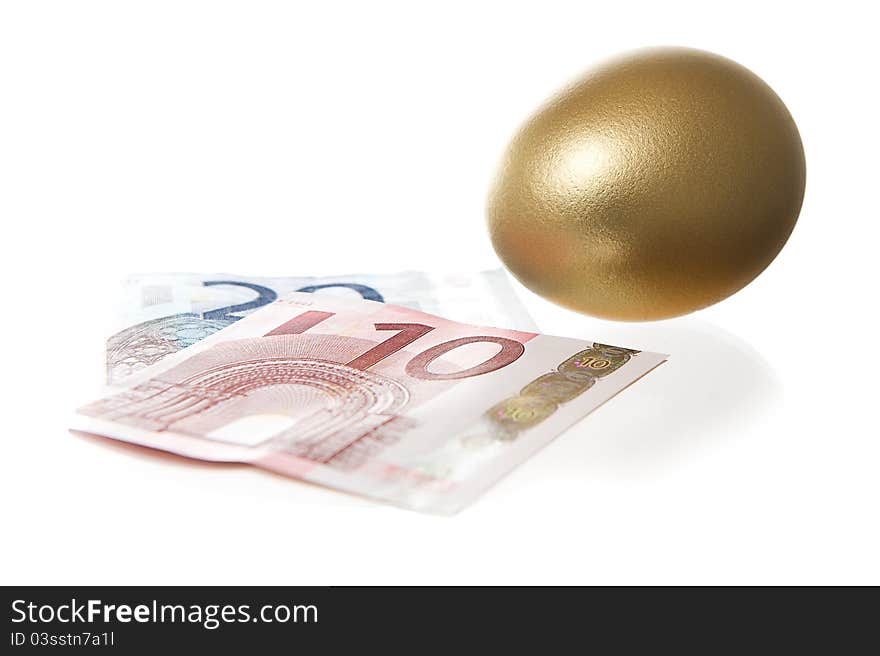 Euro and a golden egg over white bagground. Euro and a golden egg over white bagground