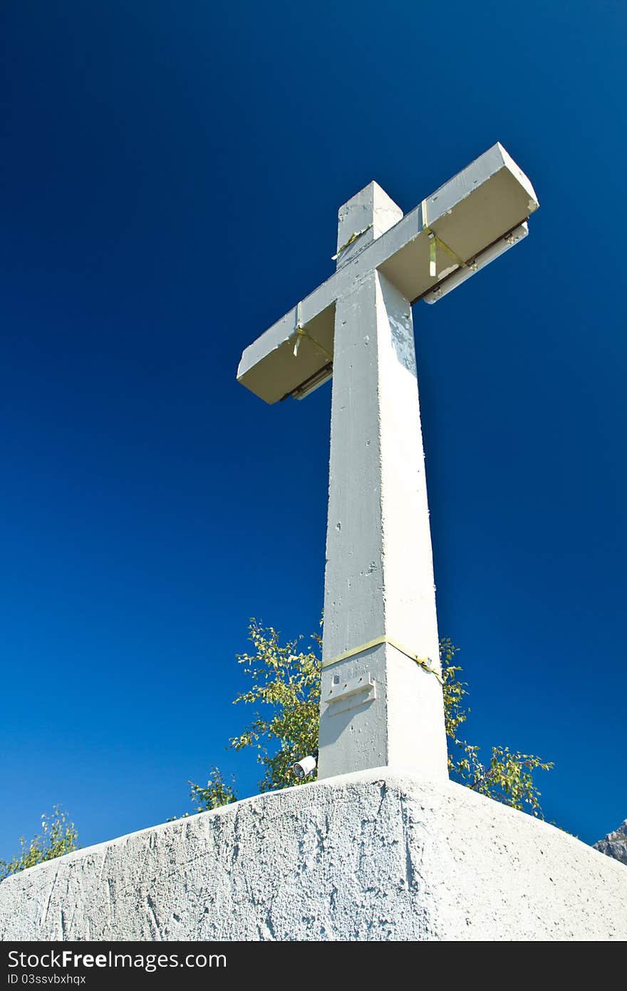 Cross symbol on mountain summit