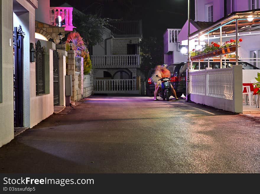 Night road with greased people, cars, buildings and trees. Night road with greased people, cars, buildings and trees.