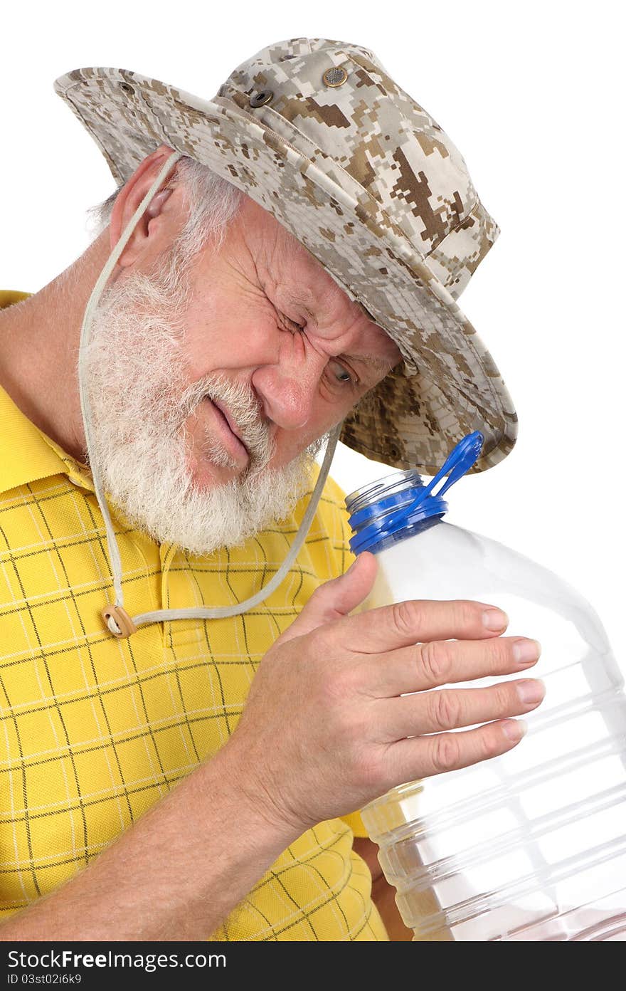 Senior man looking into empty bottle