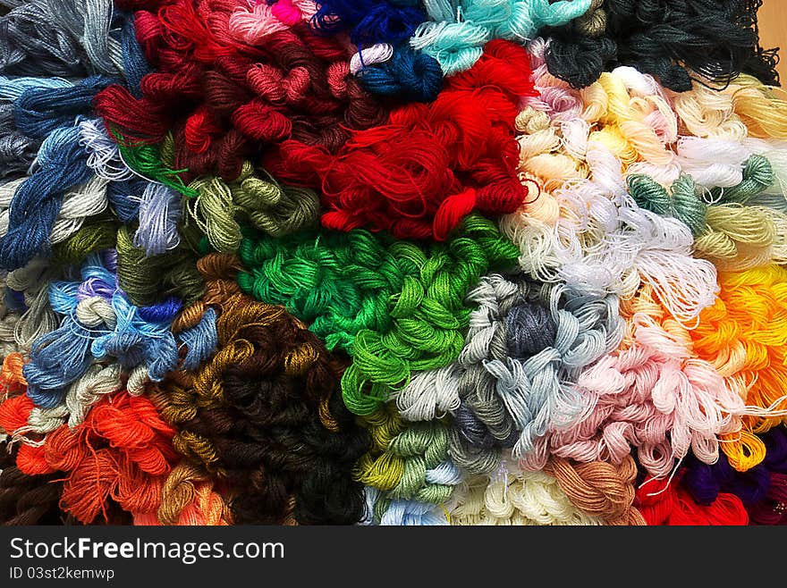 Colorful threads for embroidery, as a background, makro