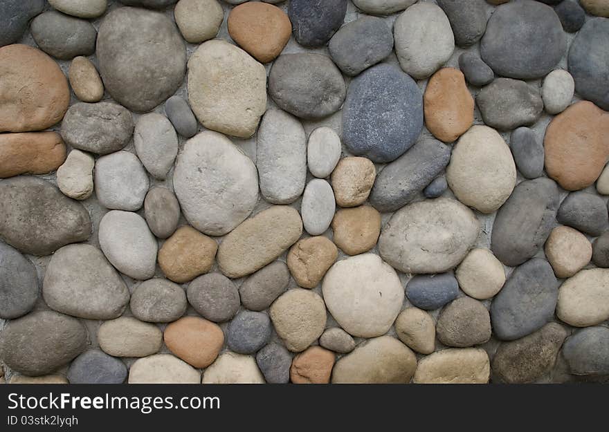 Multicolor different size Stones with cement on wall. Multicolor different size Stones with cement on wall