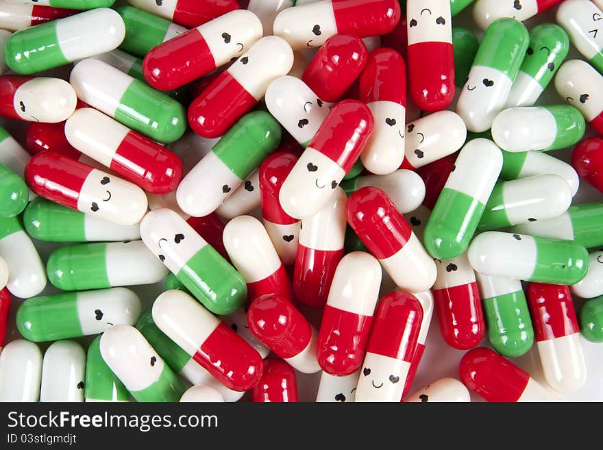 Green red and white happy emotion capsules. Green red and white happy emotion capsules