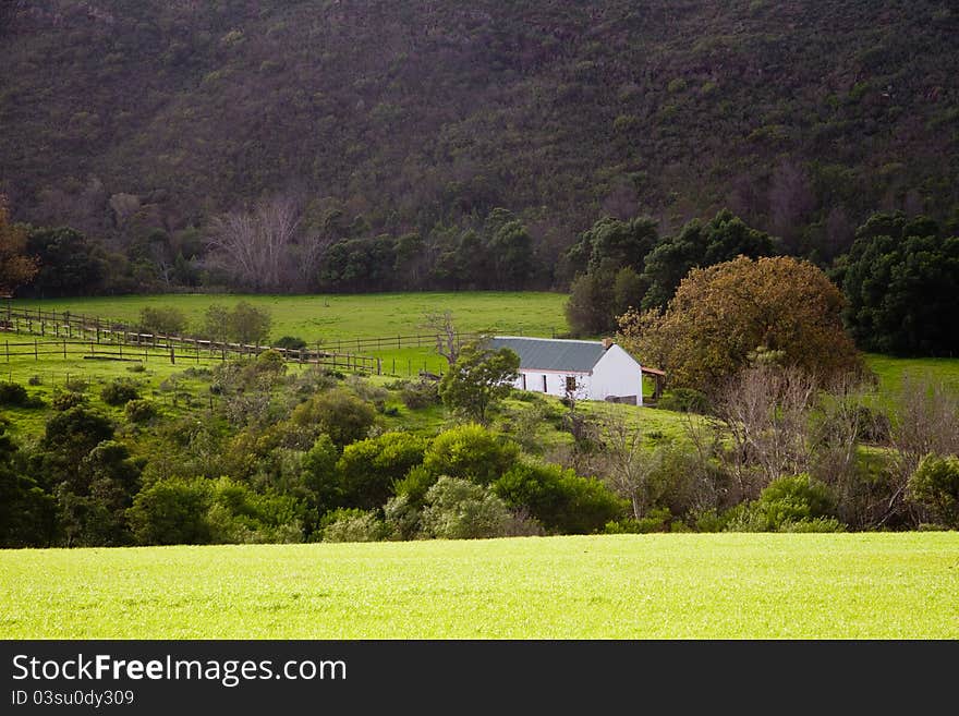 Farm landscape with an old farm house in the Overberg, Western Cape, South Africa. Farm landscape with an old farm house in the Overberg, Western Cape, South Africa