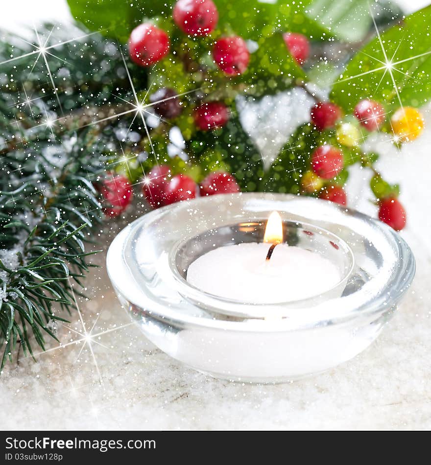 Christmas decoration with candle and snow