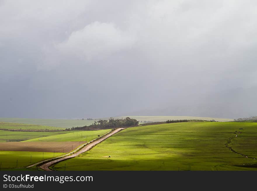 Plains landscape under stormy skies