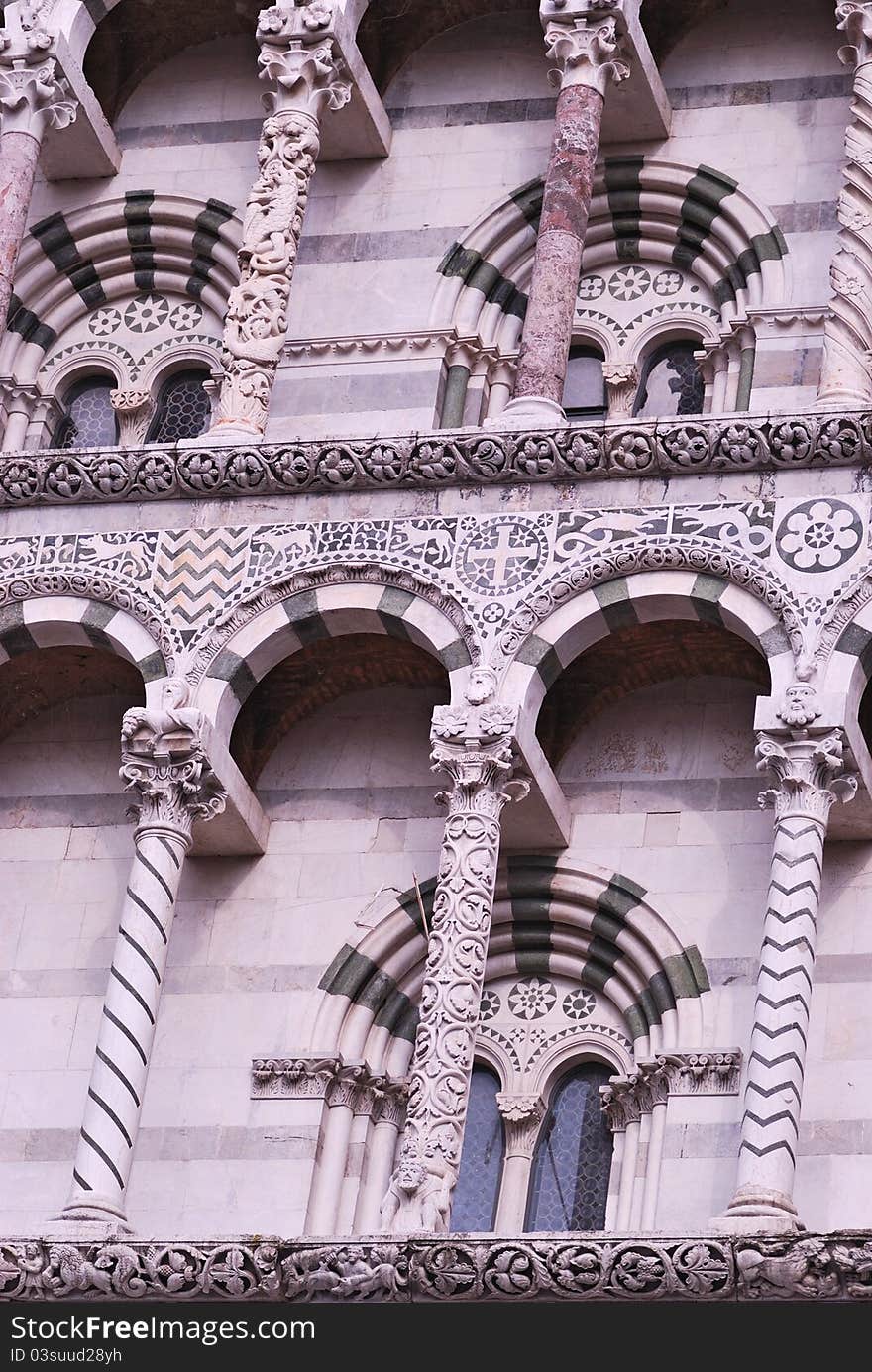 A detail of the cathedral San Martino in Lucca. Pillar in Corinthian style. A detail of the cathedral San Martino in Lucca. Pillar in Corinthian style