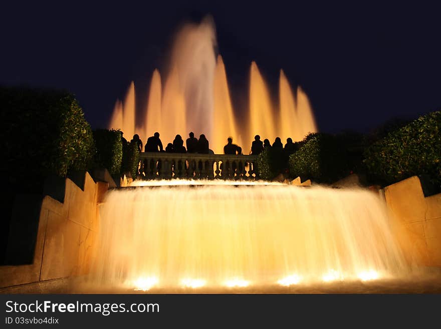 Details group tourists photographing fountain in city Barcelona, Spain