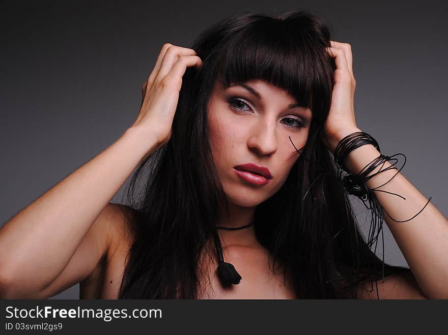 Portrait of girl on a grey background. Portrait of girl on a grey background.