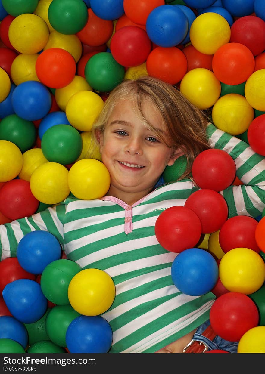 Young girl in fun balls