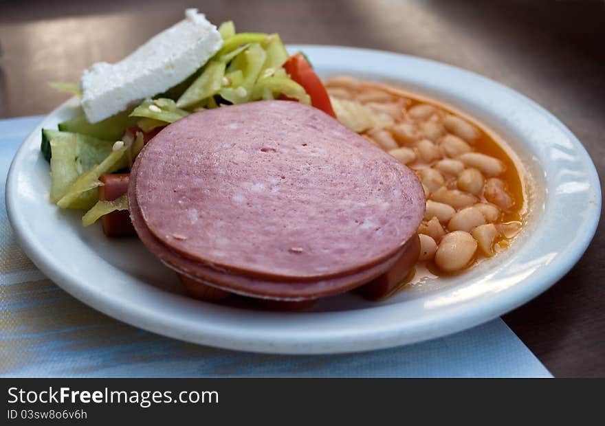 Close-up of baked beans in tomato sauce with sausage. Close-up of baked beans in tomato sauce with sausage