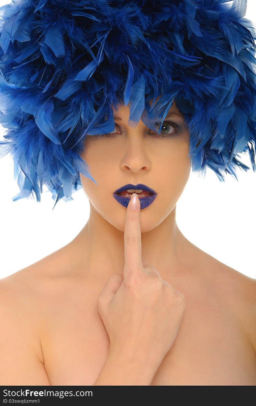 Woman with blue feathers lips and open eyes isolated on white