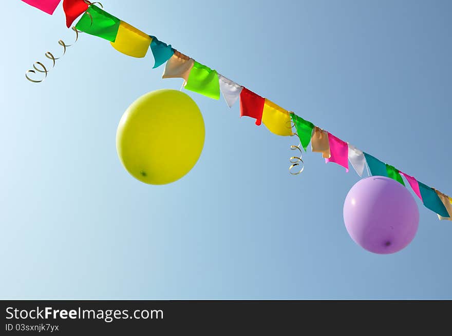 Holiday streams, flags, and balloons on the string