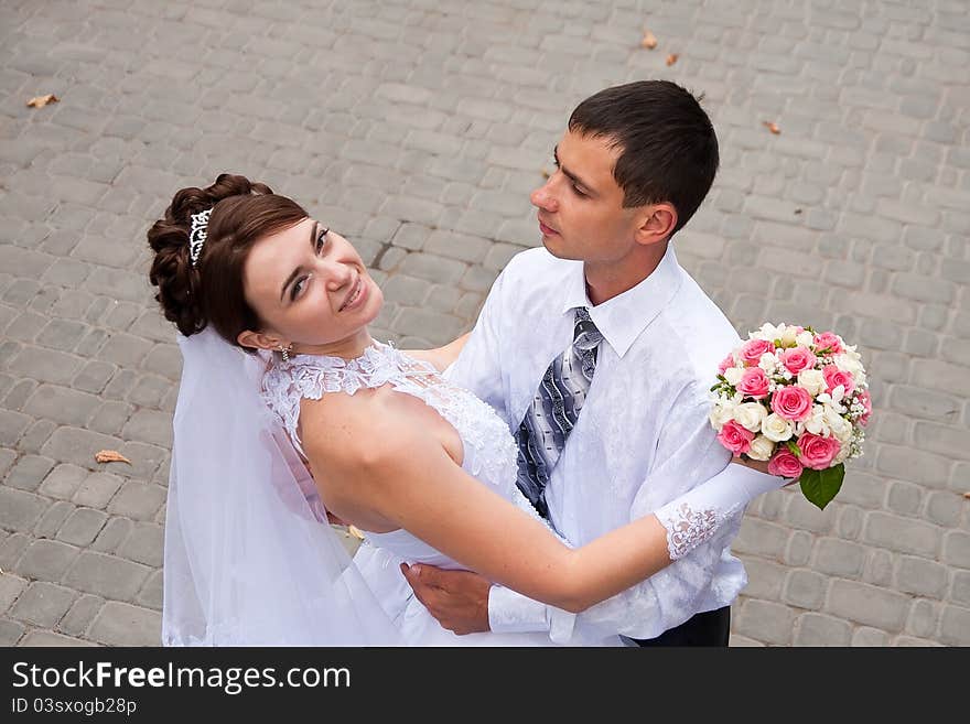 Happy Bride And Groom At The Wedding Walk