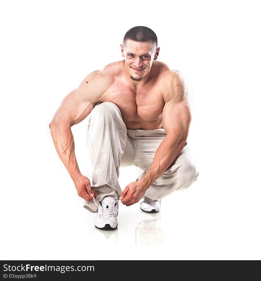 Strong athletic man isolated over white background